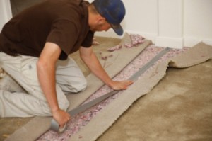 a handyman doing carpet repairs